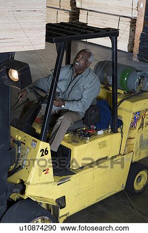 Senior forklift truck driver View Large Photo Image Stock Image - Senior forklift truck driver. Fotosearch