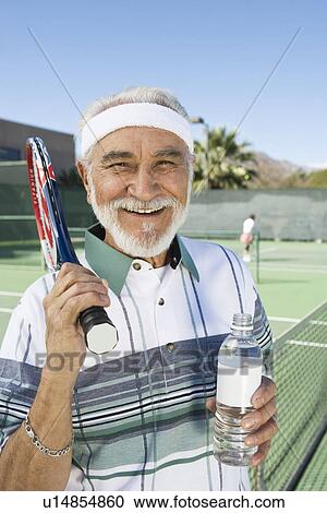 Senior man at tennis court, portrait View Large Photo Image Stock Image - Senior man at tennis court, portrait. Fotosearch