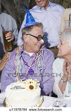 Picture - Senior man celebrating birthday. Fotosearch