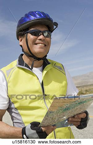 Senior man in sportswear reading map View Large Photo Image Stock Image - Senior man in sportswear reading map. Fotosearch