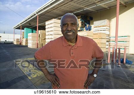 Senior man outside warehouse full of wood View Large Photo Image Stock Image - Senior man outside warehouse full of wood. Fotosearch