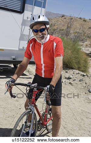 Senior man riding bike View Large Photo Image Stock Image - Senior man riding bike. Fotosearch