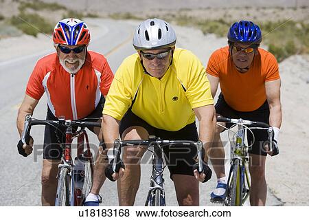 Senior men cycling View Large Photo Image Stock Photo - Senior men cycling. Fotosearch
