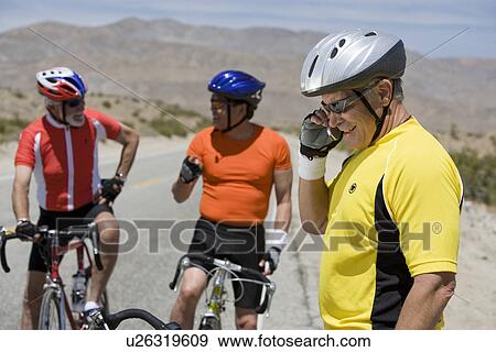 Senior men cycling View Large Photo Image Stock Photo - Senior men cycling. Fotosearch