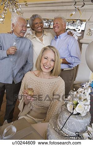 Stock Photo - Senior people celebrating birthday. Fotosearch