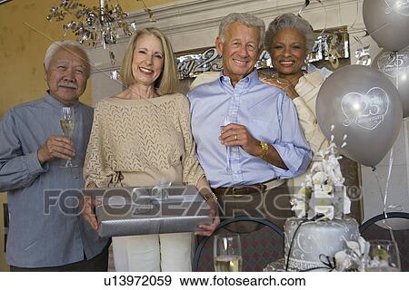 Stock Photo - Senior people celebrating birthday. Fotosearch
