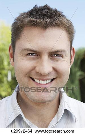 Smiling man outside View Large Photo Image Picture - Smiling man outside. Fotosearch
