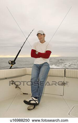 Sport fisherman on boat, (portrait) View Large Photo Image Stock Image - Sport fisherman on boat, (portrait). Fotosearch