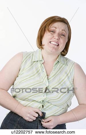 Studio portrait of overweight woman View Large Photo Image Stock Photo - Studio portrait of overweight woman. Fotosearch