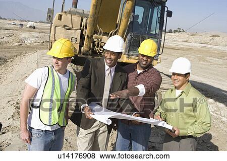 Stock Photo - Surveyor and construction workers on site. Fotosearch