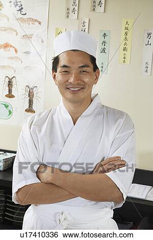 Sushi chef standing in restaurant View Large Photo Image Stock Photograph - Sushi chef standing in restaurant. Fotosearch