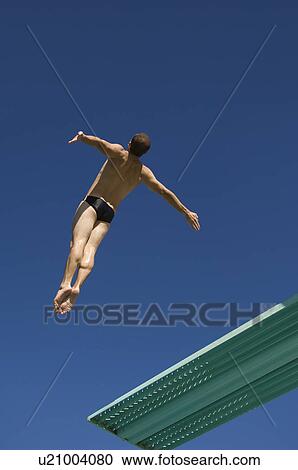 Swimmer diving into swimming pool View Large Photo Image Stock Image - Swimmer diving into swimming pool. Fotosearch