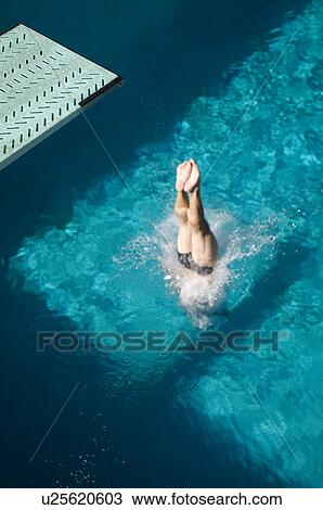 Swimmer diving into swimming pool View Large Photo Image Stock Image - Swimmer diving into swimming pool. Fotosearch