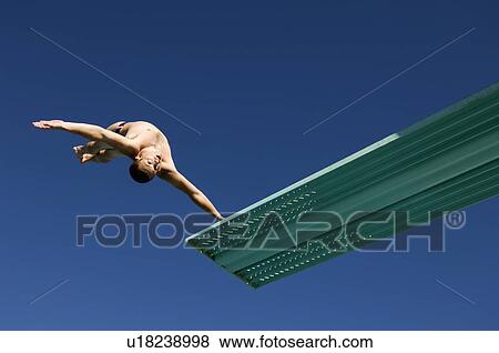 Swimmer Jumping into Swimming Pool View Large Photo Image Stock Photo - Swimmer Jumping into Swimming Pool. Fotosearch