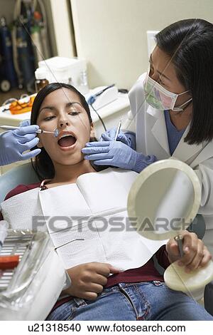 Teenage girl (13-17) at Dentists View Large Photo Image Stock Image - Teenage girl (13-17) at Dentists. Fotosearch