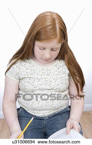 Picture - Teenage girl learning. Fotosearch