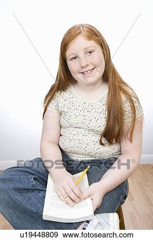Teenage girl learning View Large Photo Image Stock Photo - Teenage girl learning. Fotosearch