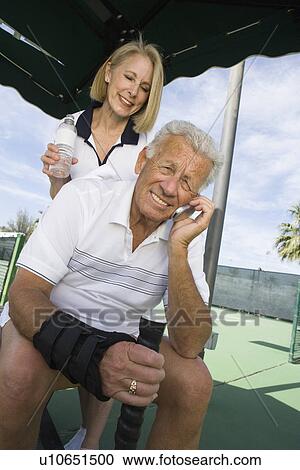 Stock Image - Tennis players on court. Fotosearch
