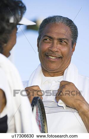 Stock Image - Tennis players talking. Fotosearch