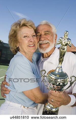 Tennis players with award cup View Large Photo Image Stock Image - Tennis players with award cup. Fotosearch