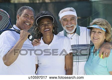 Two couples playing tennis, portrait View Large Photo Image Stock Photo - Two couples playing tennis, portrait. Fotosearch