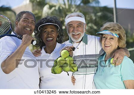 Two couples playing tennis, portrait View Large Photo Image Stock Photography - Two couples playing tennis, portrait. Fotosearch