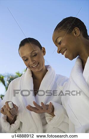 Two women in bathrobes at health spa View Large Photo Image Stock Image - Two women in bathrobes at health spa. Fotosearch