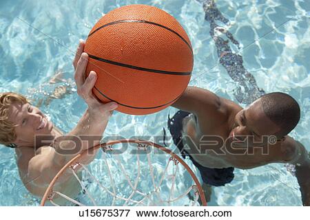 Two Young Men Playing Water Basketball, view from above View Large Photo Image Stock Photo - Two Young Men Playing Water Basketball, view from above. Fotosearch