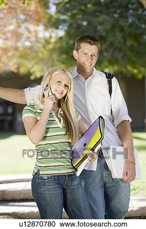 Two young students looking at camera View Large Photo Image Stock Image - Two young students looking at camera. Fotosearch