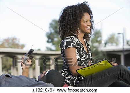 Stock Photo - Two young students relaxing. Fotosearch