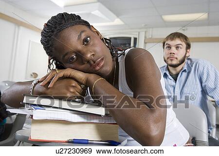 Stock Photo - University student in classroom. Fotosearch