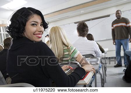 Stock Image - University students in classroom. Fotosearch