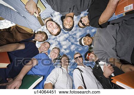 Stock Image - University students standing in circle. Fotosearch