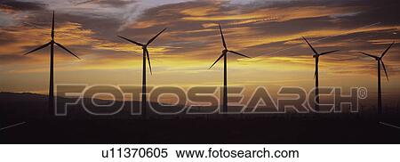 Stock Photography - Wind turbines at sunset. Fotosearch