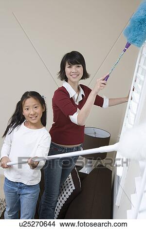 Woman and girl (10-12) doing housework View Large Photo Image Picture - Woman and girl (10-12) doing housework. Fotosearch