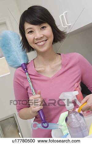 Stock Image - Woman doing housework. Fotosearch