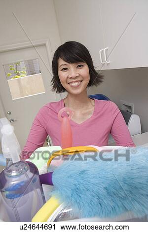 Stock Image - Woman doing housework. Fotosearch