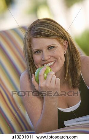 Stock Image - Woman Eating Apple. Fotosearch