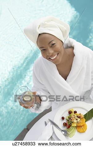 Stock Image - Woman having lunch at spa, elevated view. Fotosearch