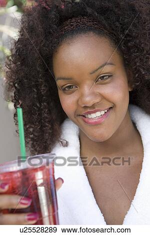 Stock Photo - Woman Holding a Drink. Fotosearch