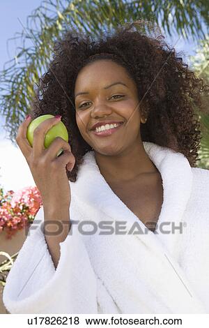 Stock Photo - Woman Holding Apple. Fotosearch