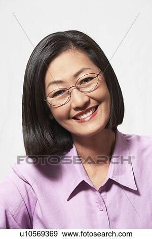 Stock Photo - Woman in glasses, portrait, head and shoulders. Fotosearch