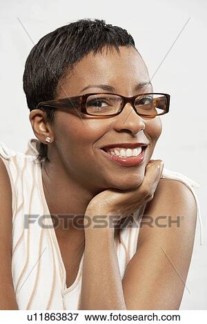 Stock Photo - Woman in glasses, portrait, head and shoulders. Fotosearch