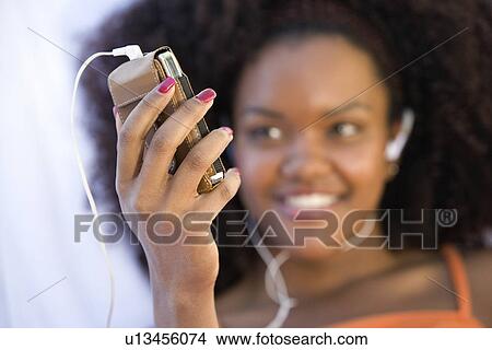 Woman Listing to Music View Large Photo Image Picture - Woman Listing to Music. Fotosearch