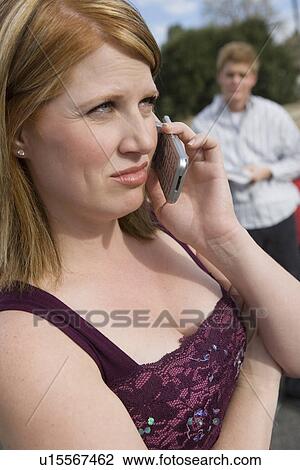 Stock Image - Woman Using Cell Phone. Fotosearch