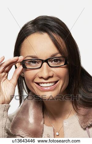 Stock Photograph - Woman wearing glasses, portrait, head and shoulders. Fotosearch