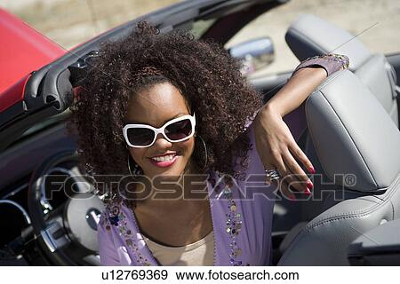 Stock Photo - Woman Wearing Sunglasses. Fotosearch
