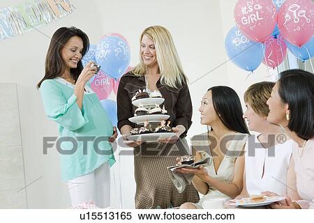 Women at a Baby Shower with Cupcakes View Large Photo Image Stock Photography - Women at a Baby Shower with Cupcakes. Fotosearch