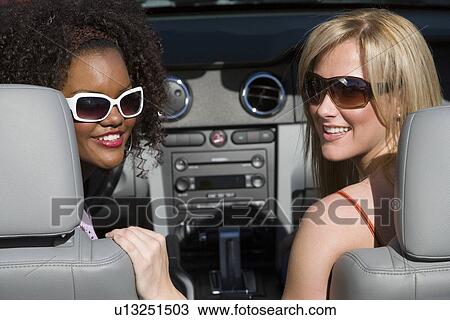 Stock Image - Women in a Car. Fotosearch