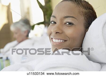 Picture - Women relaxing at spa, head and shoulders. Fotosearch